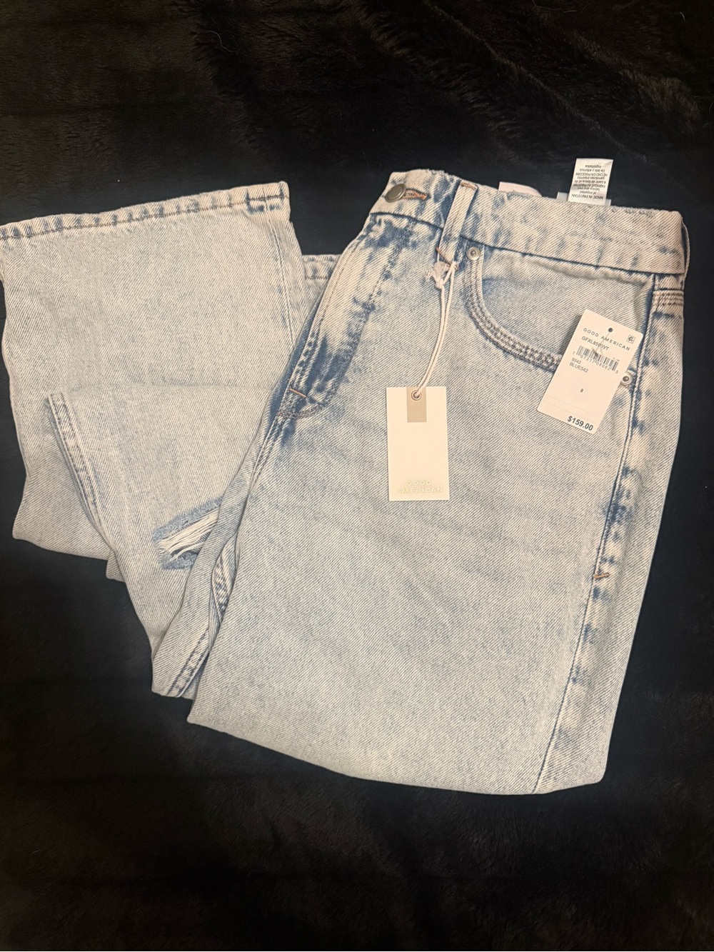 Good American ‘90s Relaxed Light Wash Distressed Straight Leg Jeans